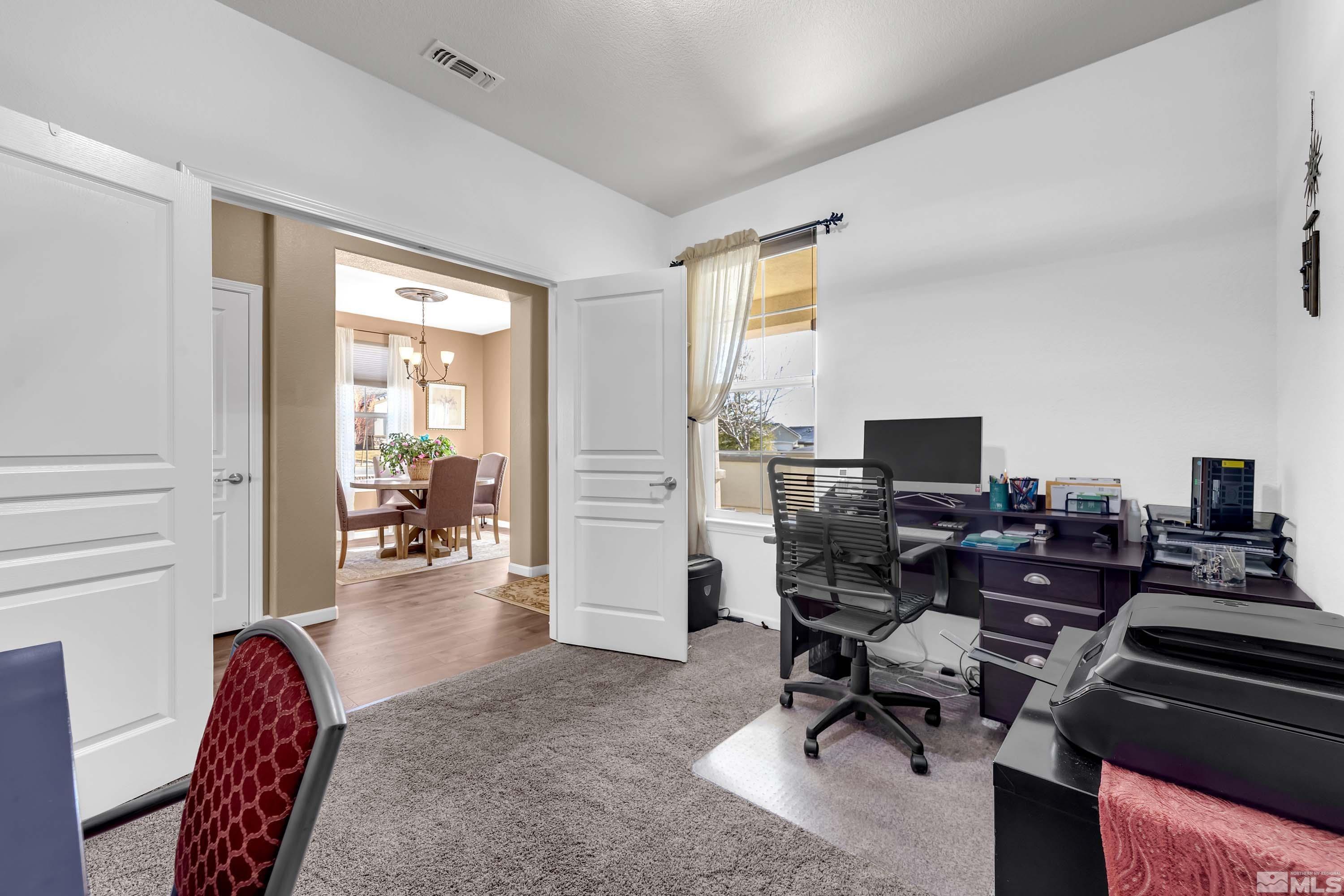 895 Larrimore Trail Reno, NV 89523 - Photo 23 of 39 a view of a livingroom with workspace and a window