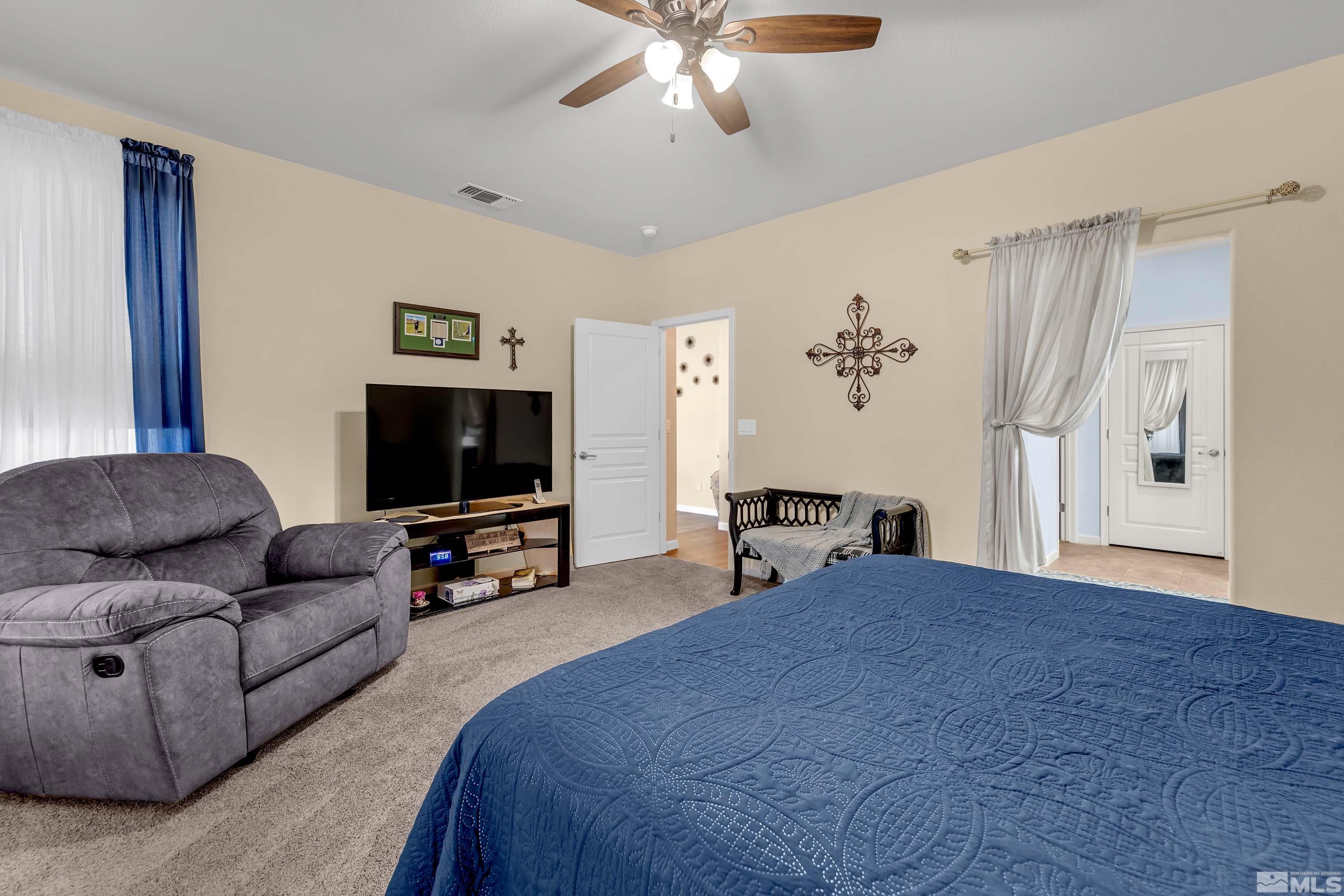 895 Larrimore Trail Reno, NV 89523 - Photo 27 of 39 a living room with furniture and a flat screen tv