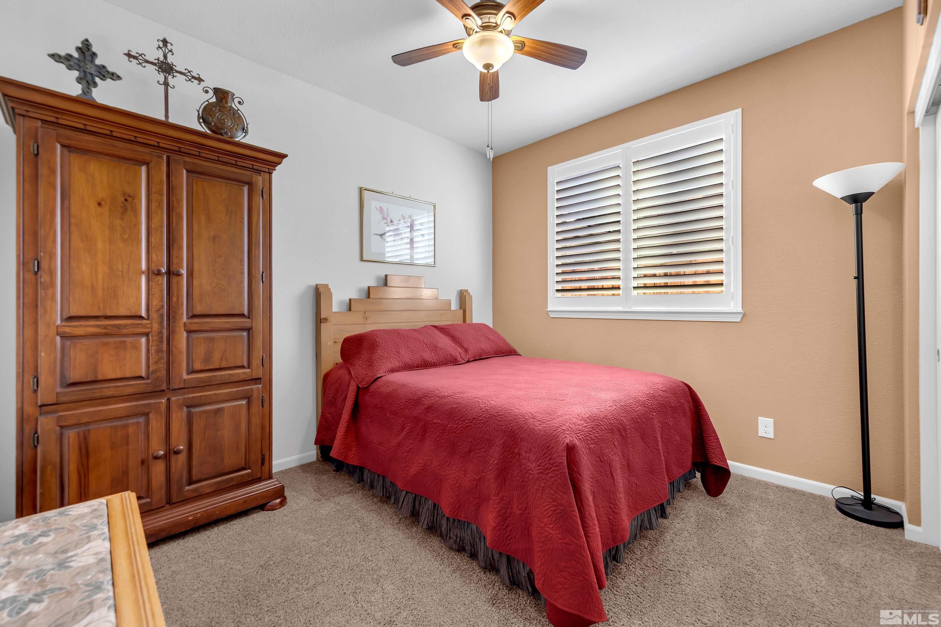 895 Larrimore Trail Reno, NV 89523 - Photo 32 of 39 a bed room with a bed and a window