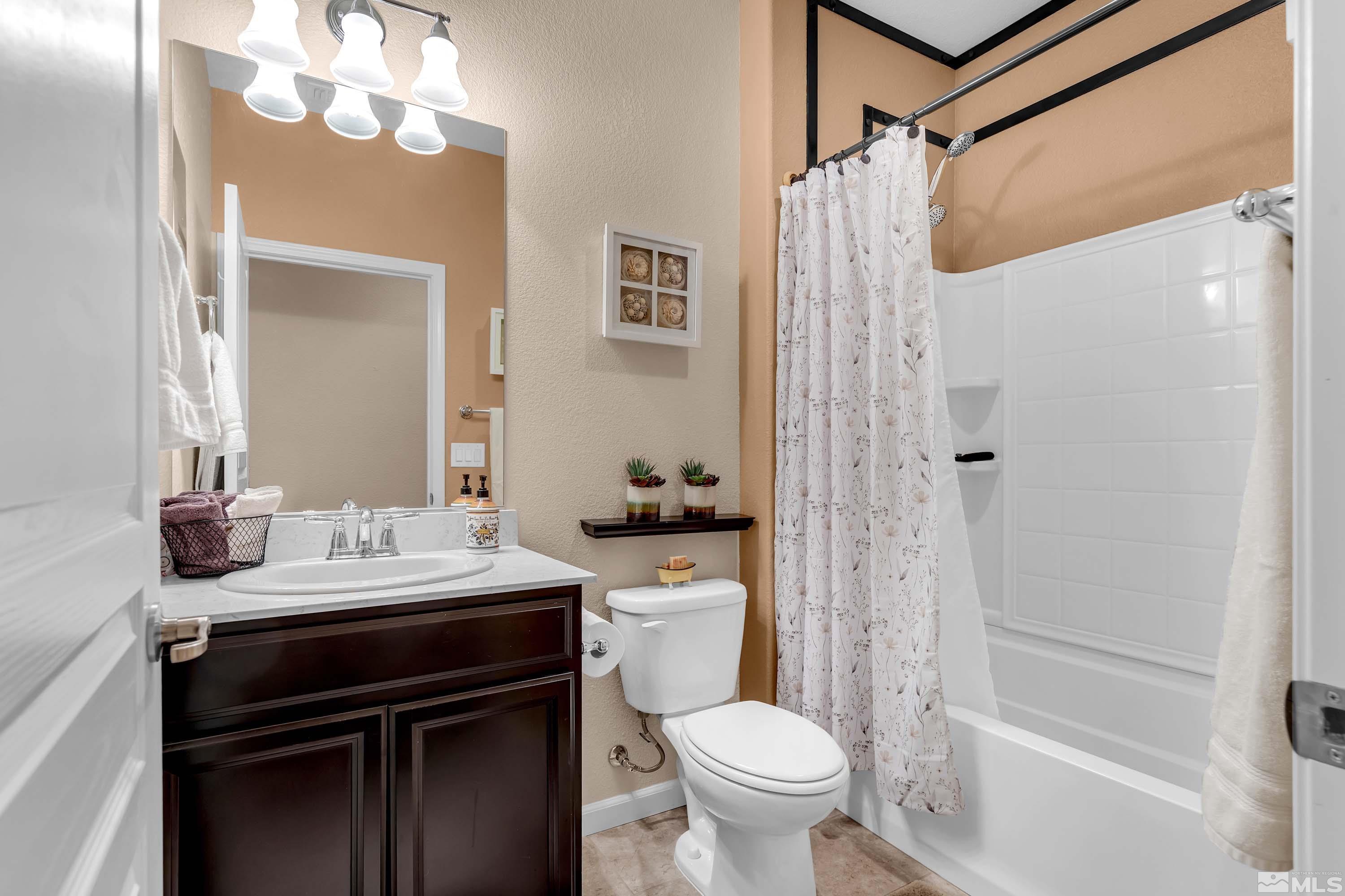 895 Larrimore Trail Reno, NV 89523 - Photo 33 of 39 a bathroom with a sink a toilet and shower