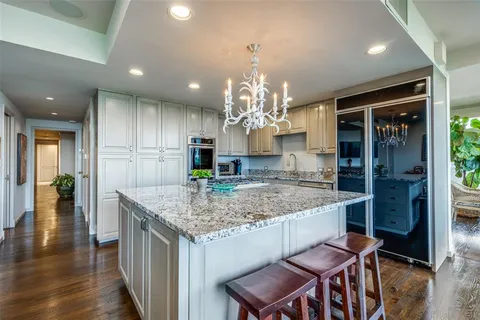a kitchen with a table and chairs in it