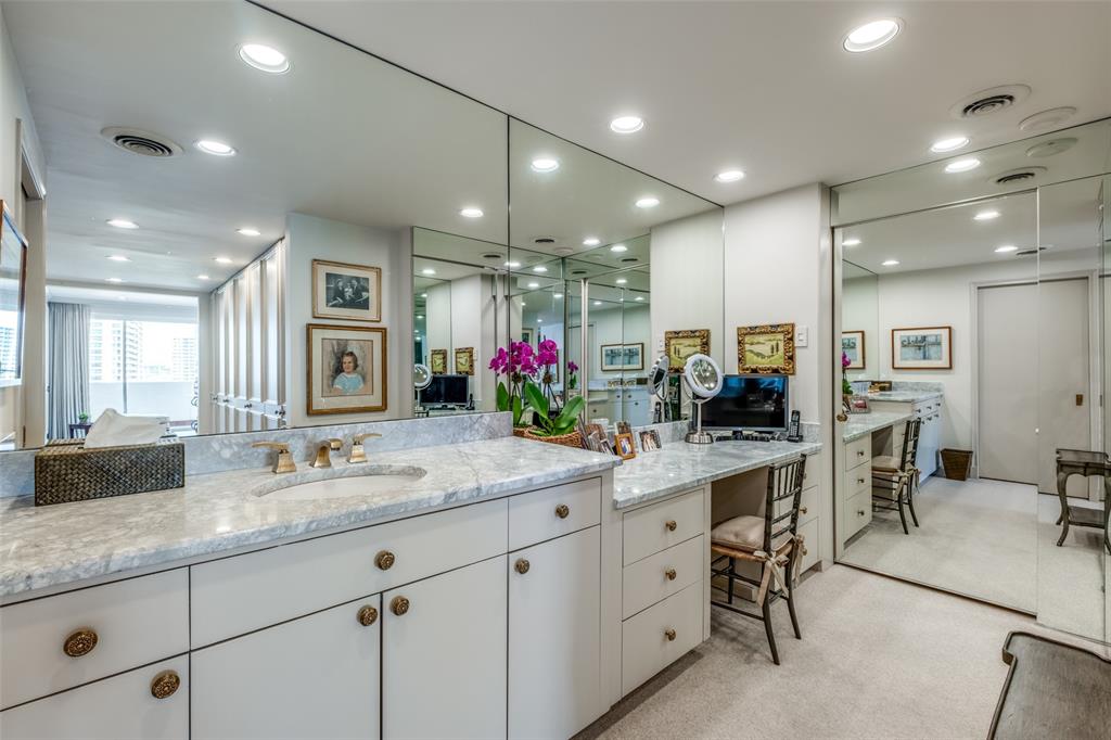 3601 Turtle Creek Boulevard, Unit 1006 Dallas, TX 75219 - Photo 17 of 28 a kitchen with sink stove and cabinets