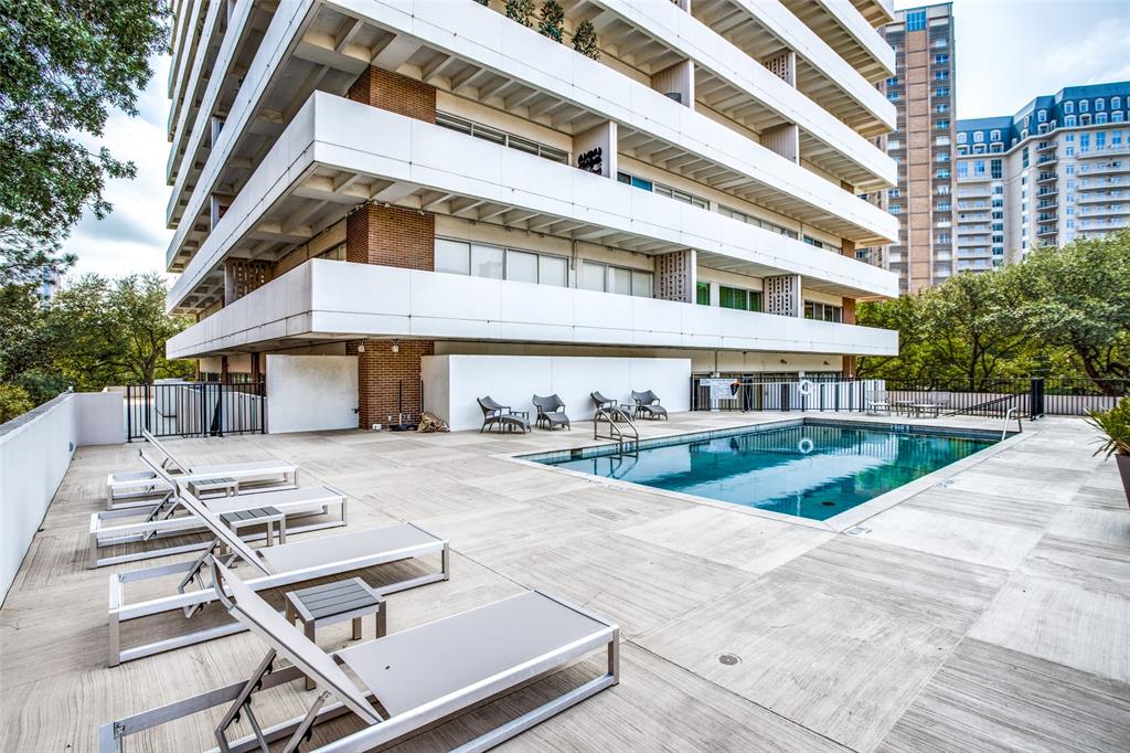 3601 Turtle Creek Boulevard, Unit 1006 Dallas, TX 75219 - Photo 23 of 28 a view of a building with a swimming pool