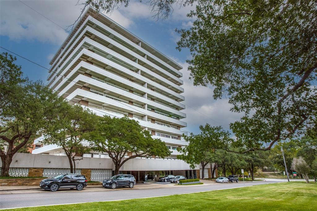 3601 Turtle Creek Boulevard, Unit 1006 Dallas, TX 75219 - Photo 27 of 28 a front view of a building with trees