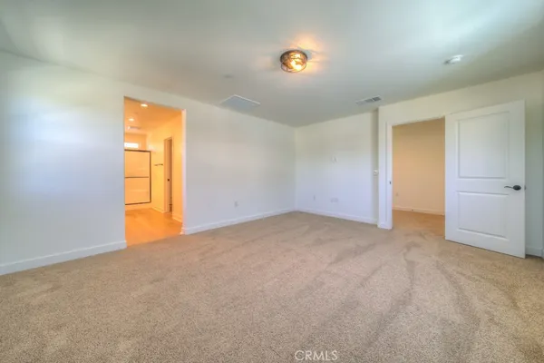 an empty room with a empty space and a window