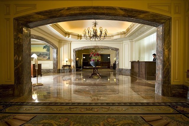 a view of hall way with furniture