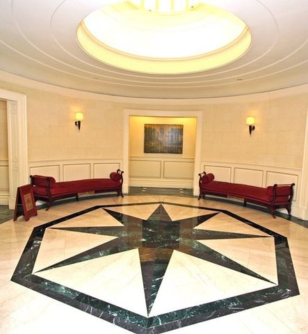 a view of a living room and kitchen