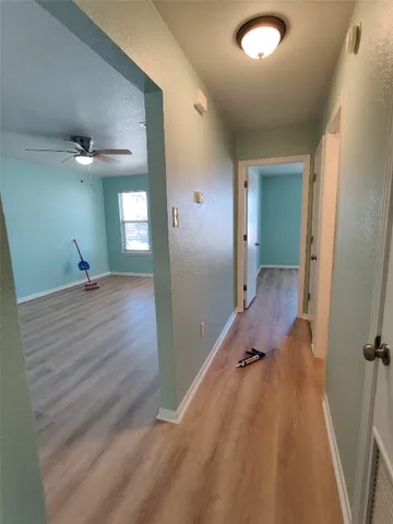 wooden floor with a bathroom