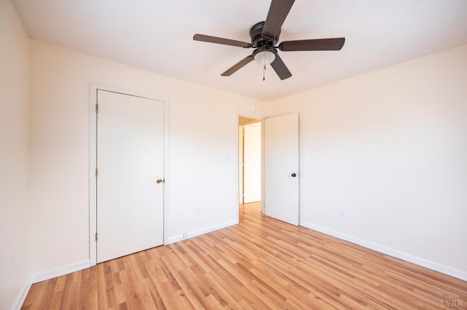 1114 Golden Leaf Road Nathalie, VA 24577 - Photo 19 of 32 a view of empty room with wooden floor