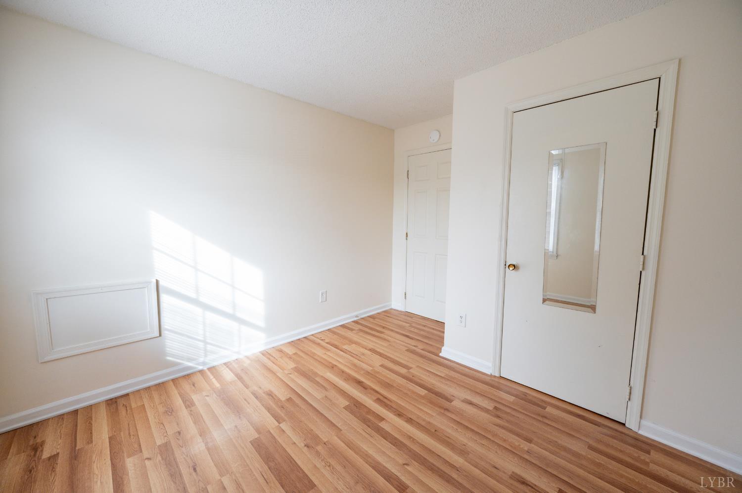 1114 Golden Leaf Road Nathalie, VA 24577 - Photo 23 of 32 a view of empty room with wooden floor