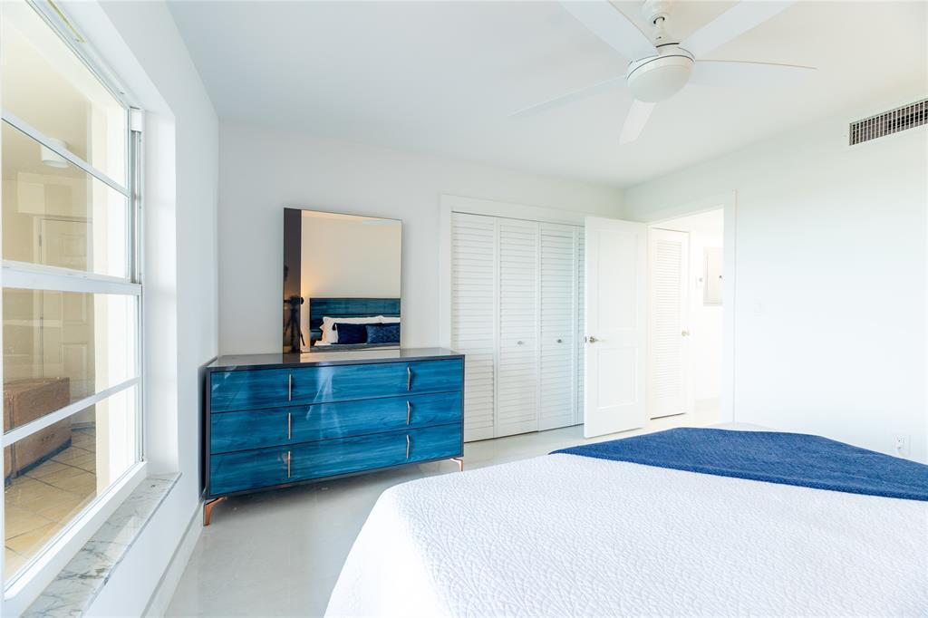 1021 Hillsboro Mile, Unit 308 Hillsboro Beach, FL 33062 - Photo 14 of 24 a bedroom with a bed and a dresser