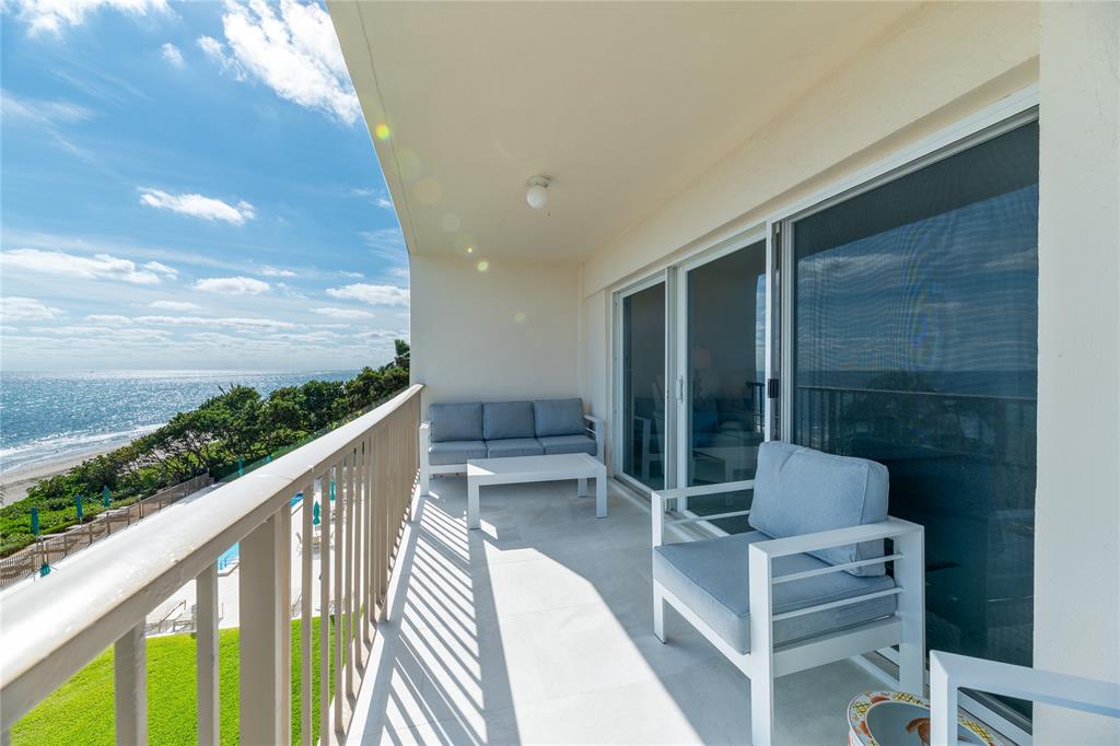 1021 Hillsboro Mile, Unit 308 Hillsboro Beach, FL 33062 - Photo 18 of 24 a balcony with table and chairs