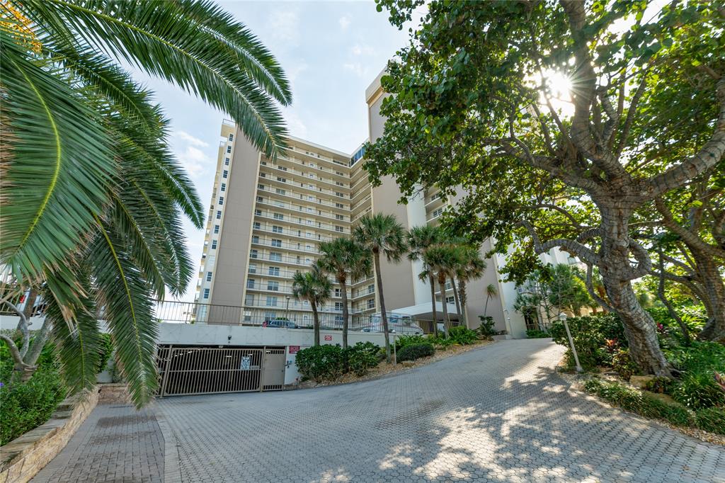 1021 Hillsboro Mile, Unit 308 Hillsboro Beach, FL 33062 - Photo 22 of 24 a couple of palm trees in front of house