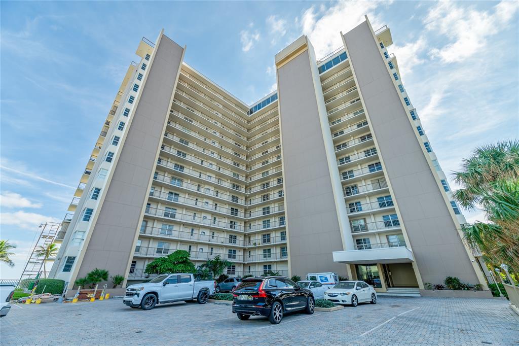 1021 Hillsboro Mile, Unit 308 Hillsboro Beach, FL 33062 - Photo 23 of 24 a car parked in front of a building