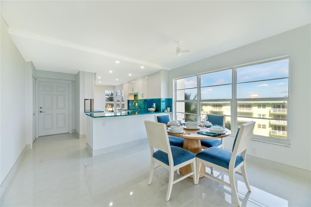1021 Hillsboro Mile, Unit 308 Hillsboro Beach, FL 33062 - Photo 5 of 24 a dining room with furniture a window and kitchen view
