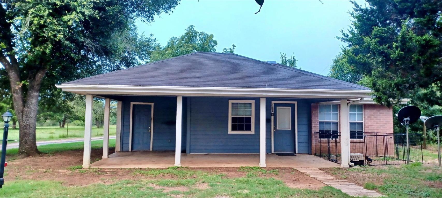 224 Crooked Hollow Road Elgin, TX 78621 - Photo 22 of 35 a view of a house with a yard and plants