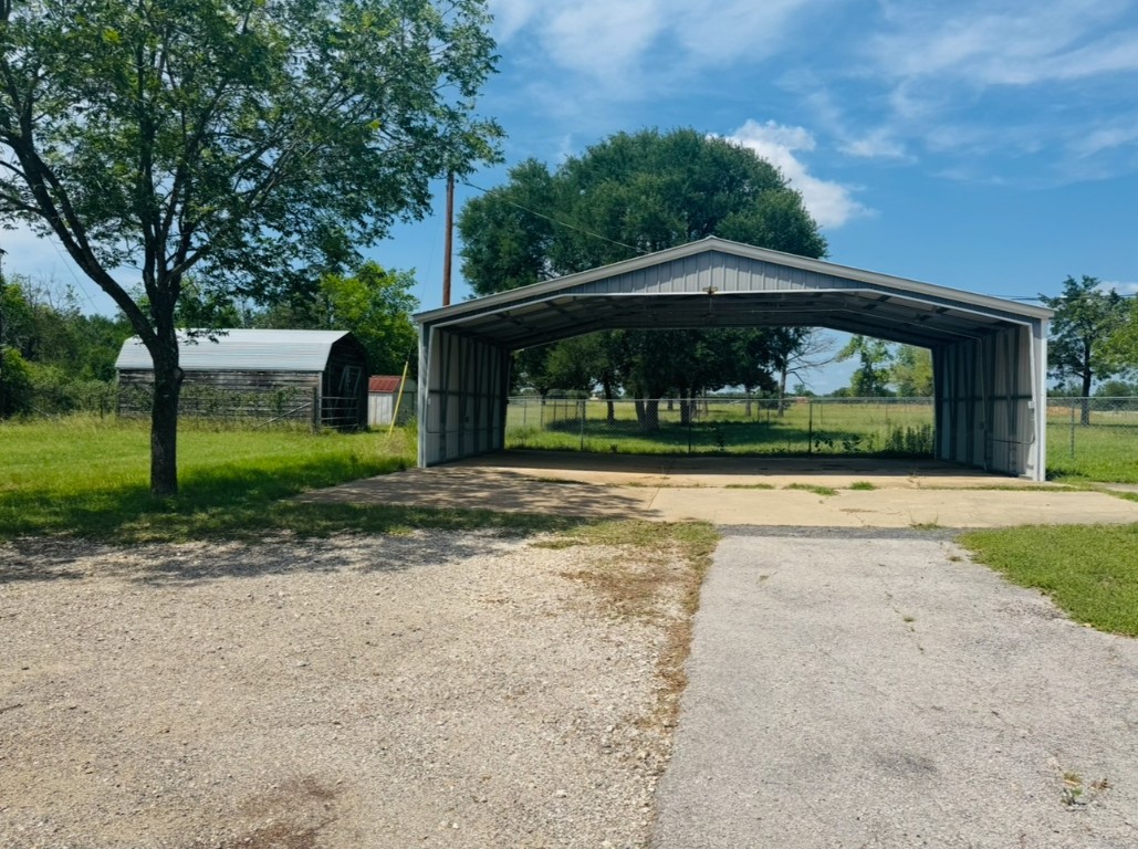 224 Crooked Hollow Road Elgin, TX 78621 - Photo 27 of 35 a front view of a house with a yard
