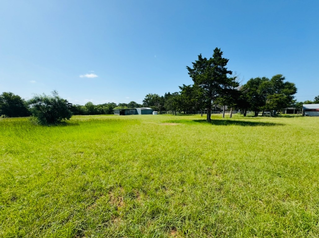 224 Crooked Hollow Road Elgin, TX 78621 - Photo 31 of 35 a view of a lake with a big yard