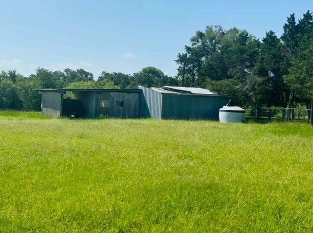 a view of a lake with houses in the back