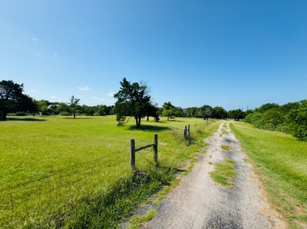224 Crooked Hollow Road Elgin, TX 78621 - Photo 34 of 35 a view of a lake with a big yard