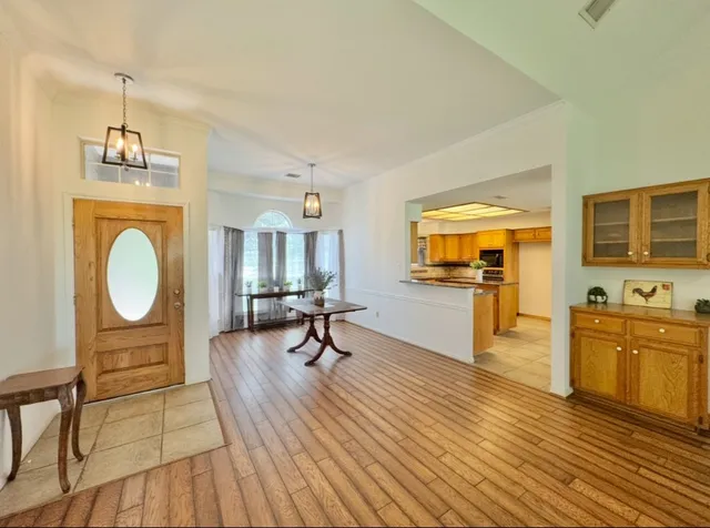 a view of a livingroom with furniture a flat screen tv and outdoor space