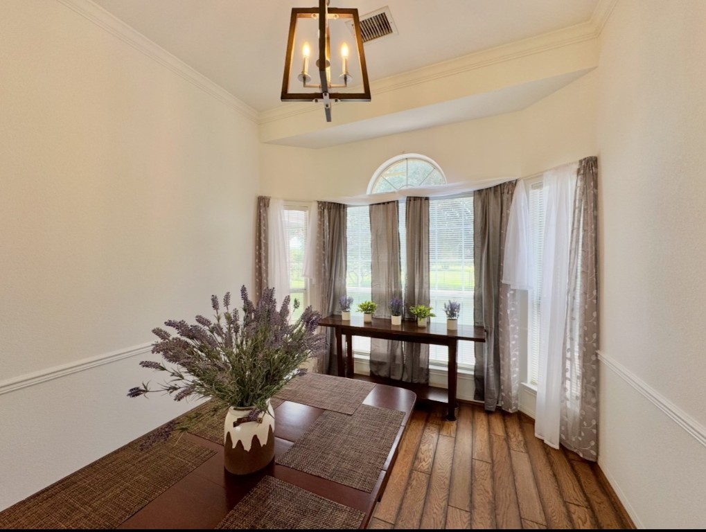 224 Crooked Hollow Road Elgin, TX 78621 - Photo 6 of 35 a view of a room with wooden floor and bench