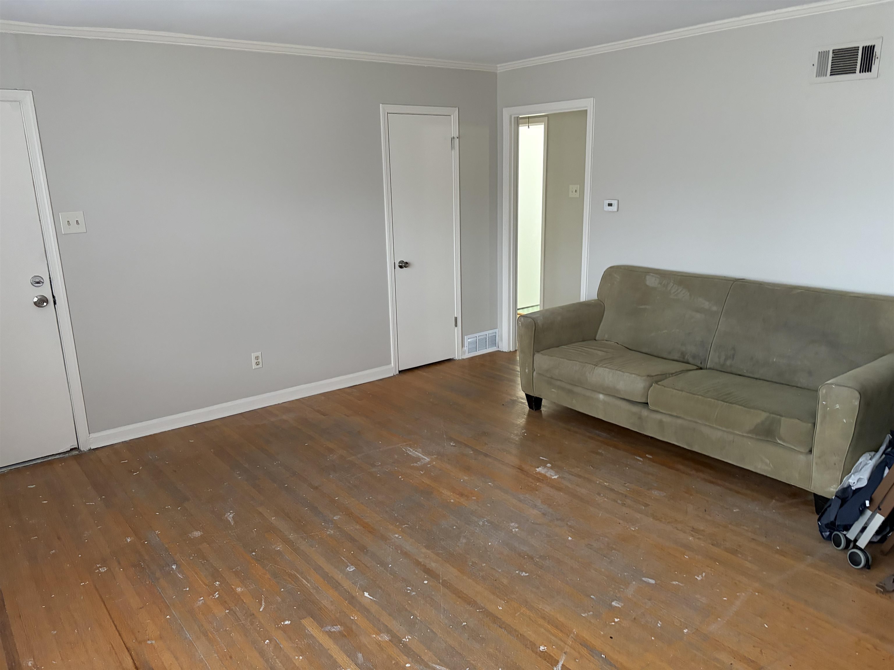 4928 Willow Road Memphis, TN 38117 - Photo 15 of 16 Living room featuring wood-type flooring and crown molding