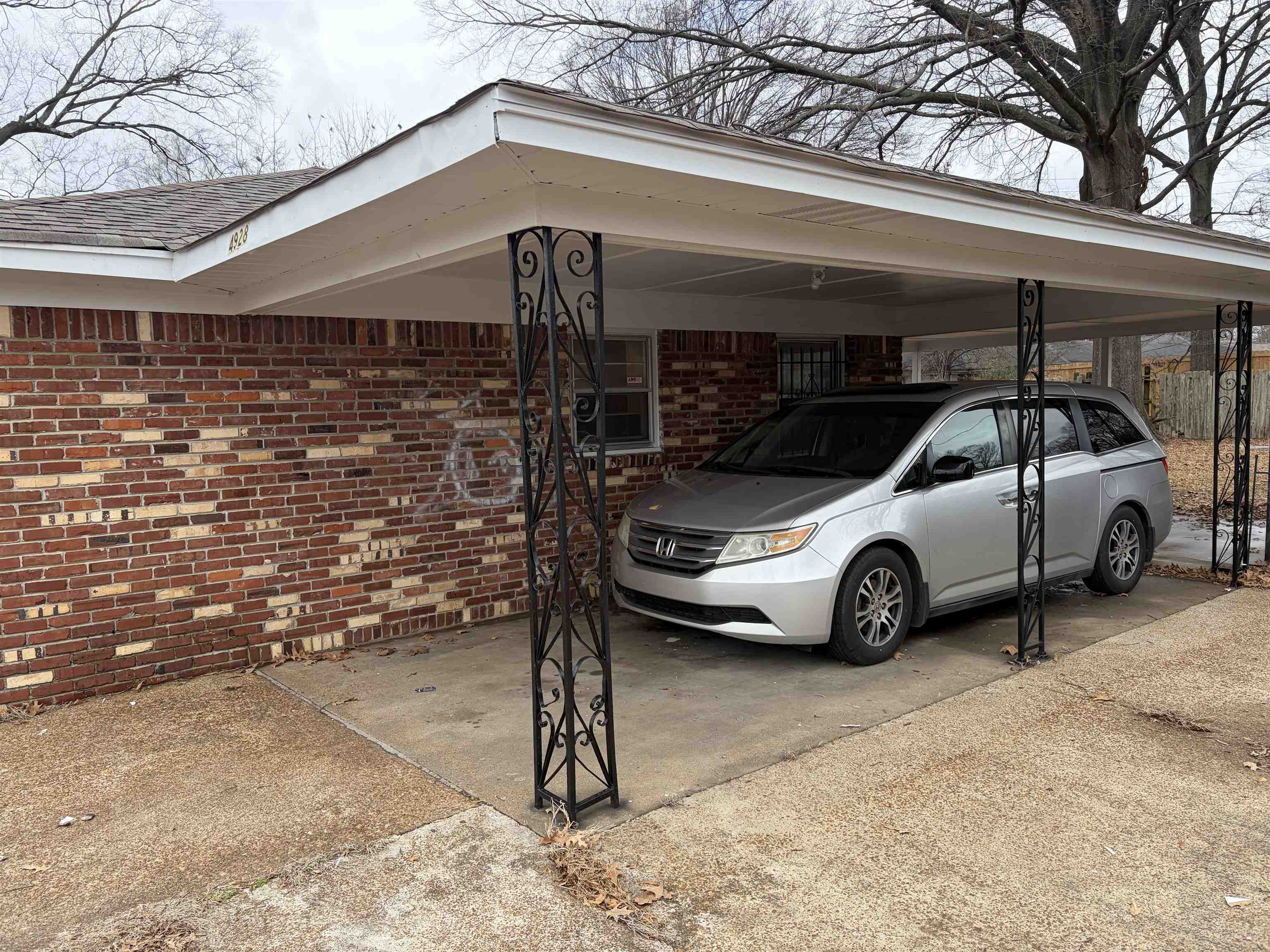 4928 Willow Road Memphis, TN 38117 - Photo 3 of 16 View of parking with a carport and driveway