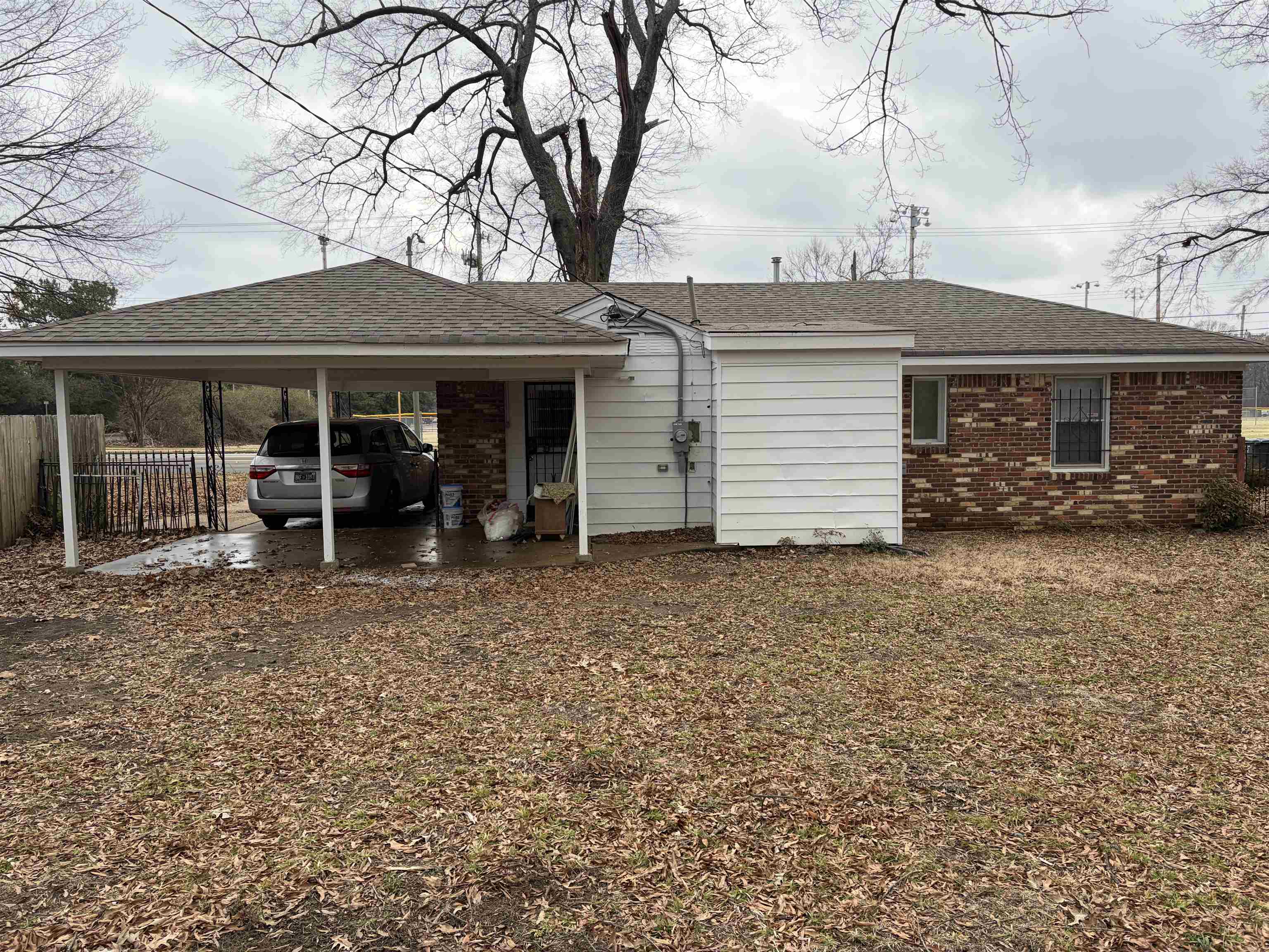 4928 Willow Road Memphis, TN 38117 - Photo 5 of 16 Back of house with roof with shingles and brick siding