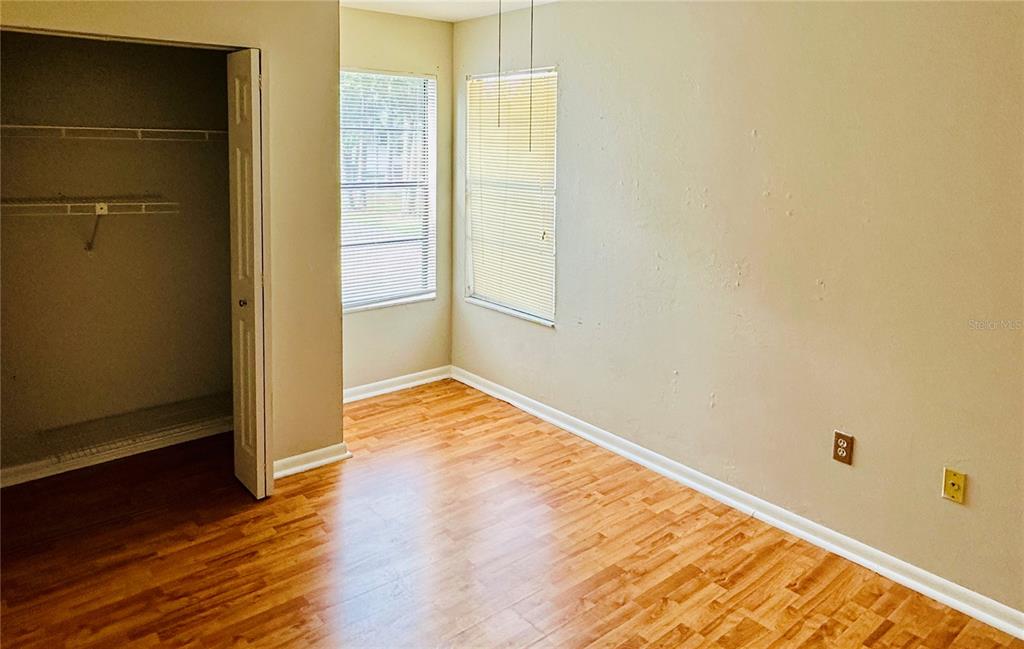 4345 Southwest 20th Lane, Unit 4345 Gainesville, FL 32607 - Photo 27 of 36 a view of empty room with wooden floor
