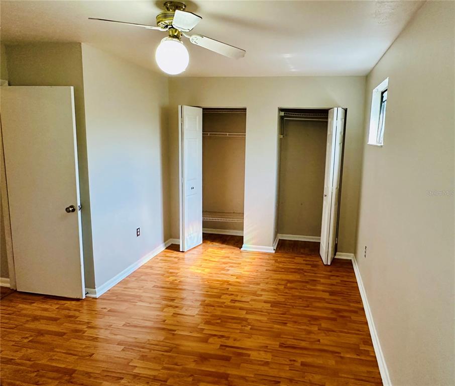 4345 Southwest 20th Lane, Unit 4345 Gainesville, FL 32607 - Photo 30 of 36 a view of an empty room with closet and a window
