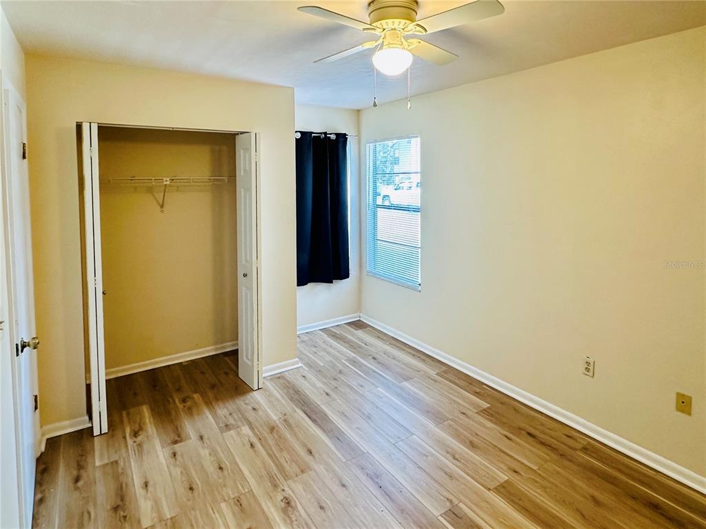 4345 Southwest 20th Lane, Unit 4345 Gainesville, FL 32607 - Photo 31 of 36 wooden floor in an empty room with a window