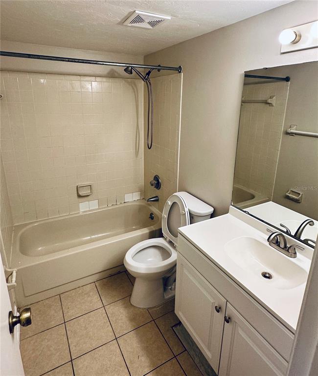 4345 Southwest 20th Lane, Unit 4345 Gainesville, FL 32607 - Photo 32 of 36 a bathroom with a sink a toilet and shower