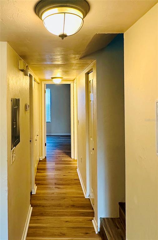4345 Southwest 20th Lane, Unit 4345 Gainesville, FL 32607 - Photo 34 of 36 a view of a hallway with wooden floor