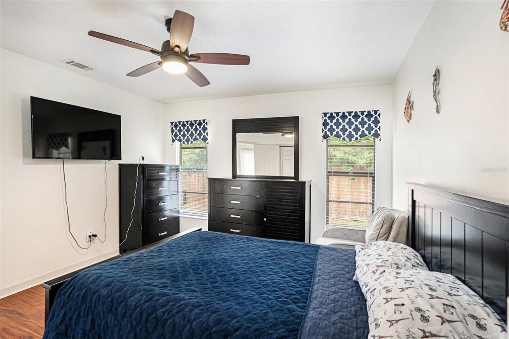 1619 Palace Court Valrico, FL 33594 - Photo 25 of 32 a bedroom with a bed and a television