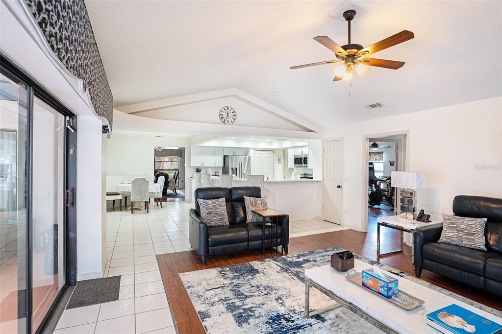 1619 Palace Court Valrico, FL 33594 - Photo 6 of 32 a living room with furniture and a chandelier