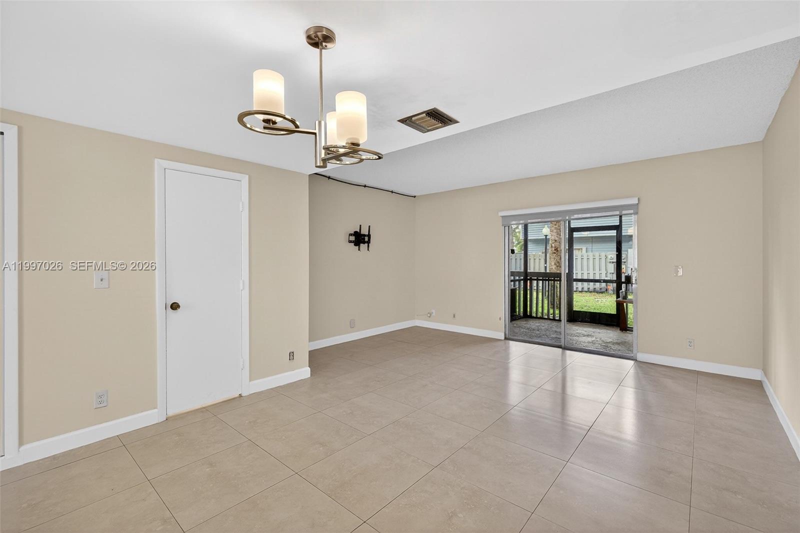 85 Southwest 3rd Street Pompano Beach, FL 33060 - Photo 13 of 29 a view of an empty room with a window