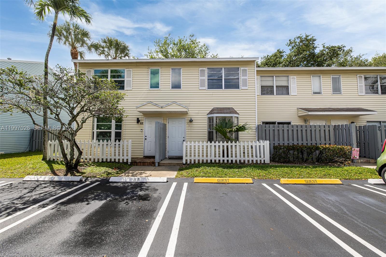 85 Southwest 3rd Street Pompano Beach, FL 33060 - Photo 3 of 29 a view of a house with a swimming pool and a yard
