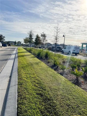 a view of a yard and ocean view