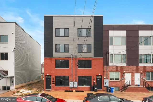 a city street lined with buildings and cars