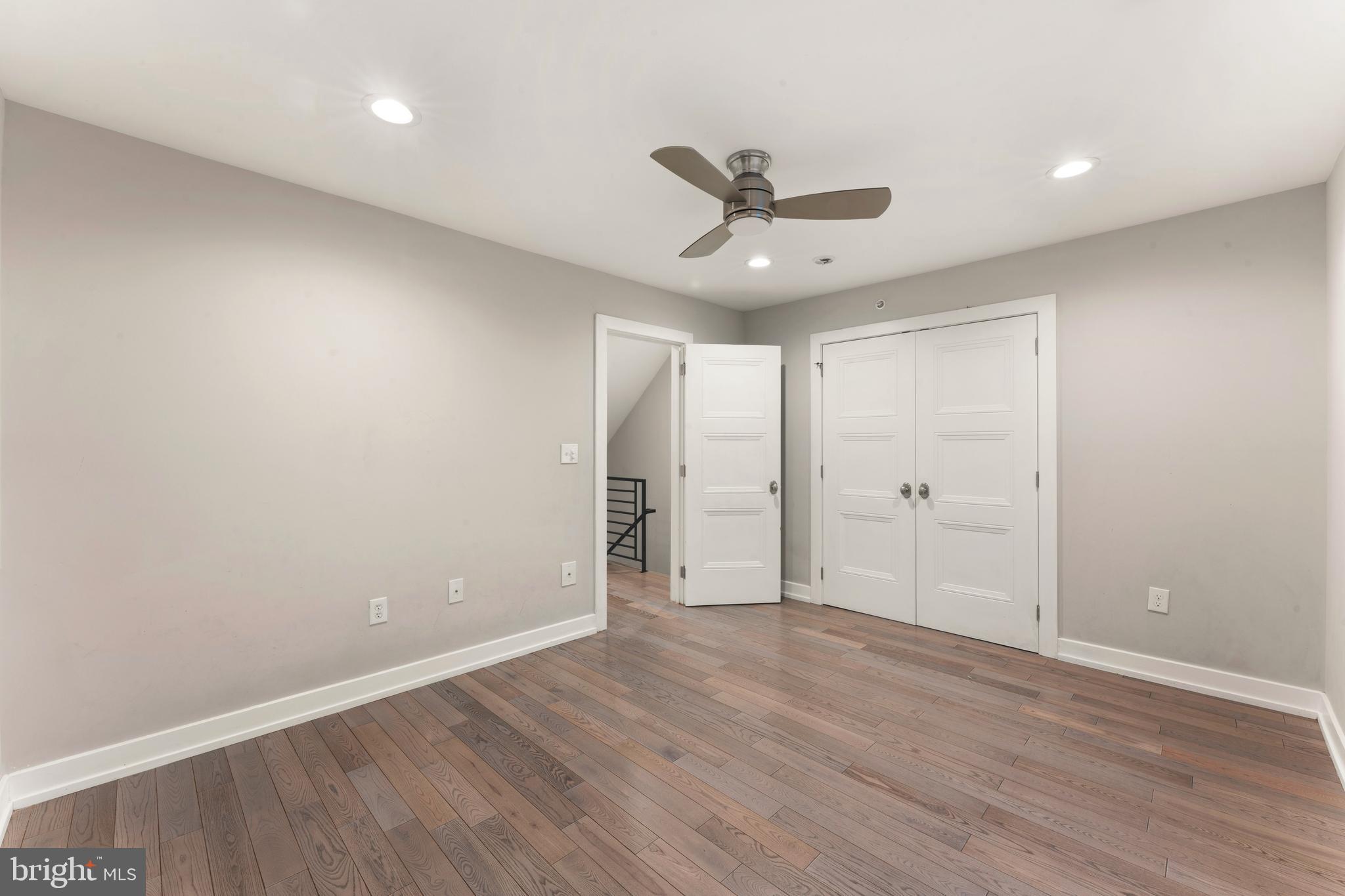 1407 North 8th Street, Unit A1 Philadelphia, PA 19122 - Photo 14 of 22 a view of an empty room with wooden floor