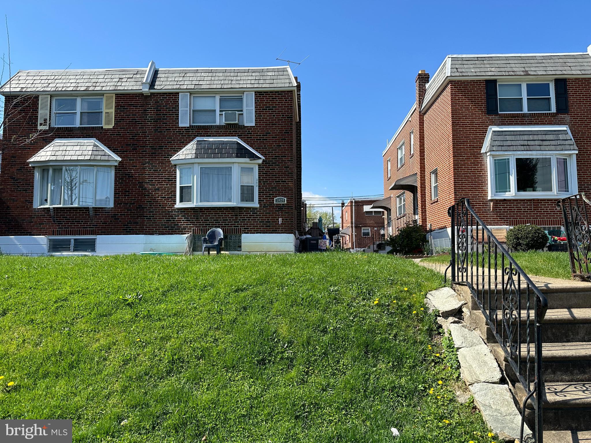 3024 Windish Street Philadelphia, PA 19152 - Photo 1 of 32 a front view of a house with a yard