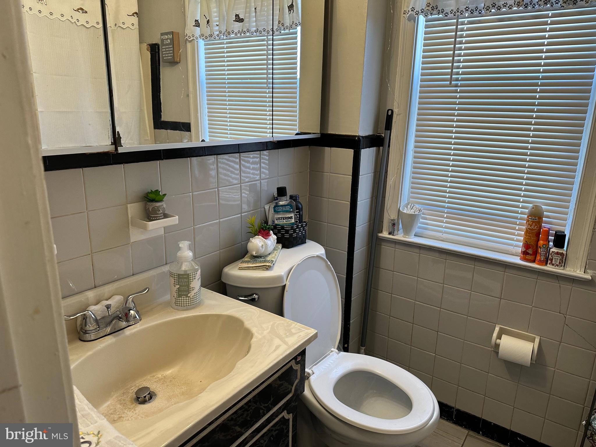 3024 Windish Street Philadelphia, PA 19152 - Photo 23 of 32 a bathroom with a sink a toilet and a mirror