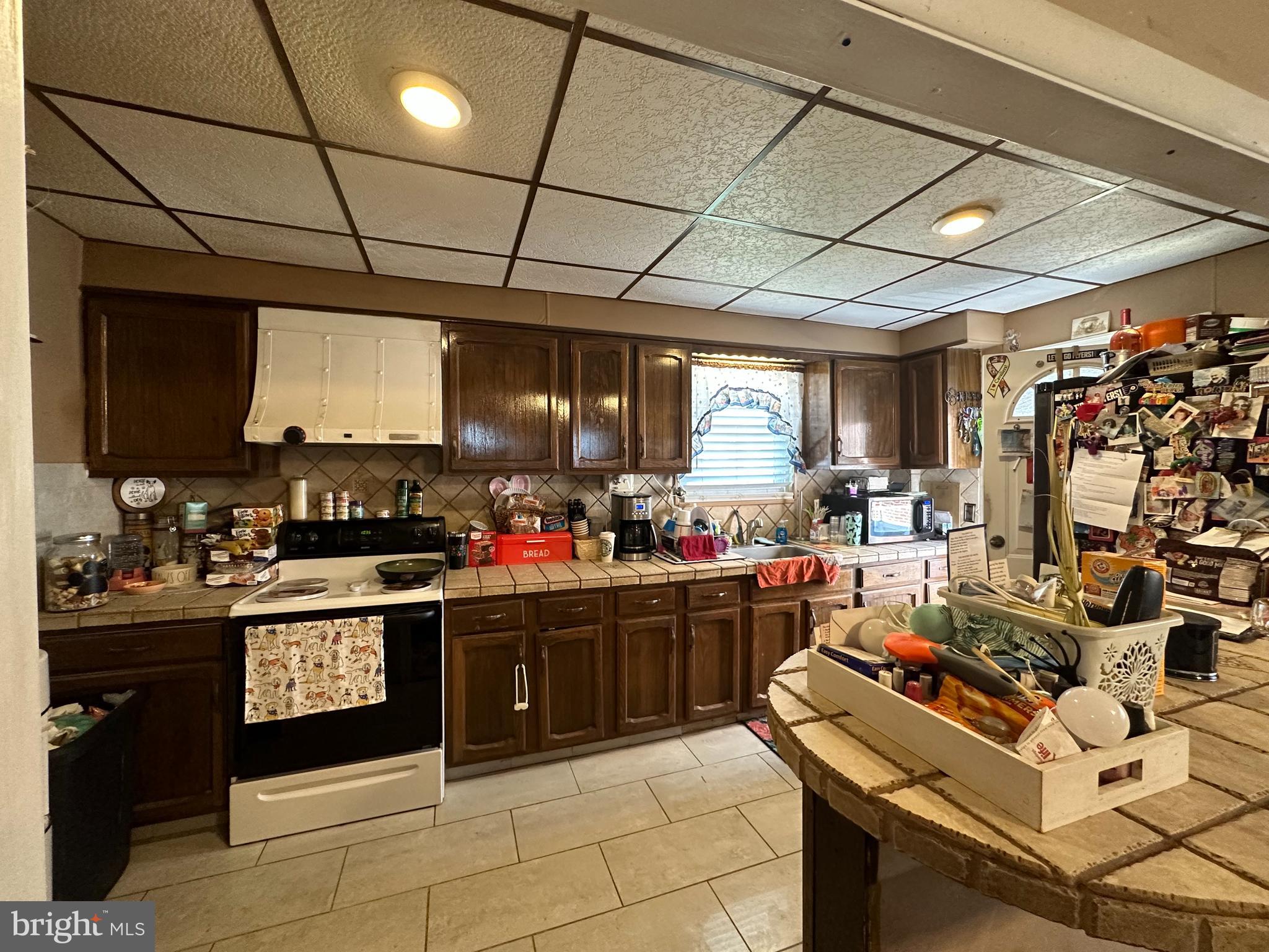 3024 Windish Street Philadelphia, PA 19152 - Photo 8 of 32 a kitchen with lots of counter top space and a window