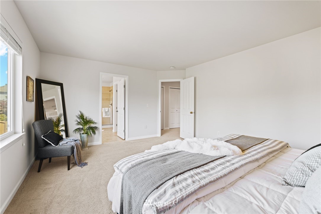3007 182nd Place Southeast Bothell, WA 98012 - Photo 16 of 33 a bedroom with a bed and a large window