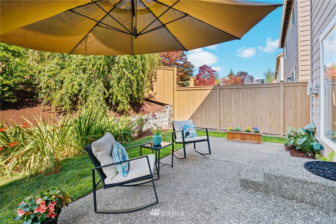 3007 182nd Place Southeast Bothell, WA 98012 - Photo 26 of 33 a backyard of a house with table and chairs