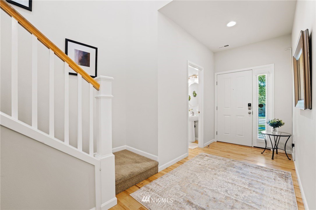 3007 182nd Place Southeast Bothell, WA 98012 - Photo 4 of 33 a view of a livingroom with wooden floor and stairs