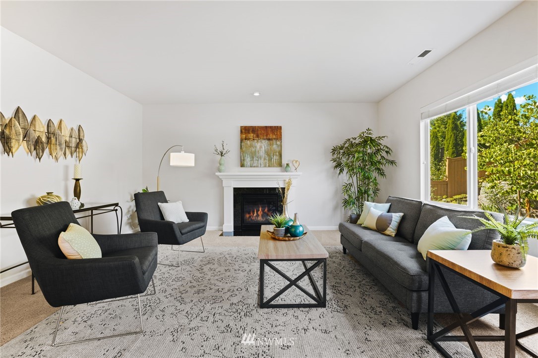 3007 182nd Place Southeast Bothell, WA 98012 - Photo 5 of 33 a living room with furniture and a fireplace