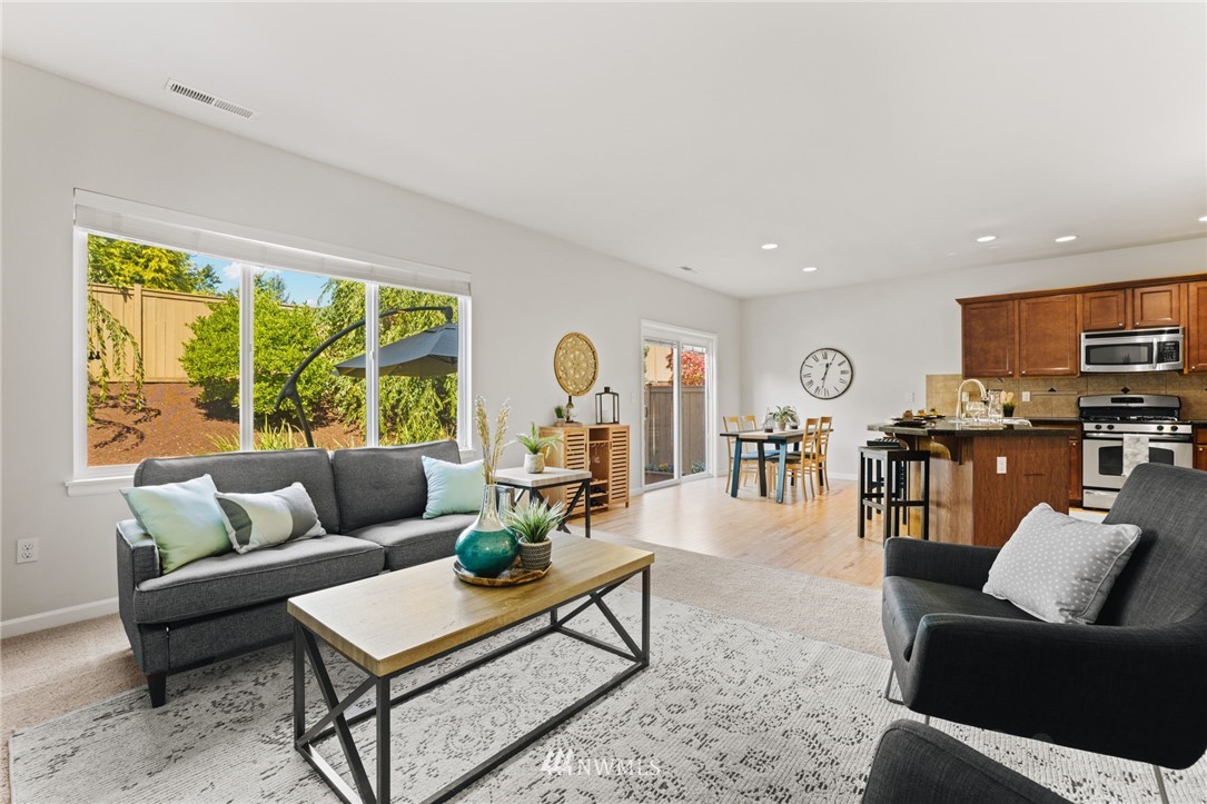 3007 182nd Place Southeast Bothell, WA 98012 - Photo 6 of 33 a living room with furniture and a large window