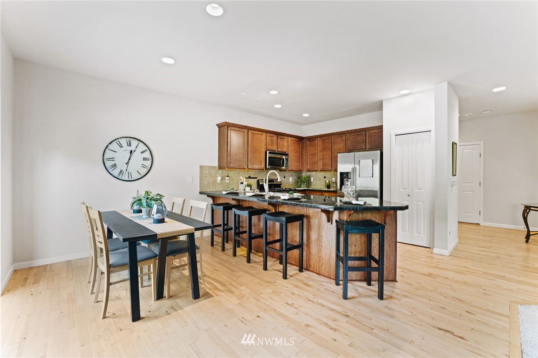 3007 182nd Place Southeast Bothell, WA 98012 - Photo 7 of 33 a view of a dining room with furniture and a table